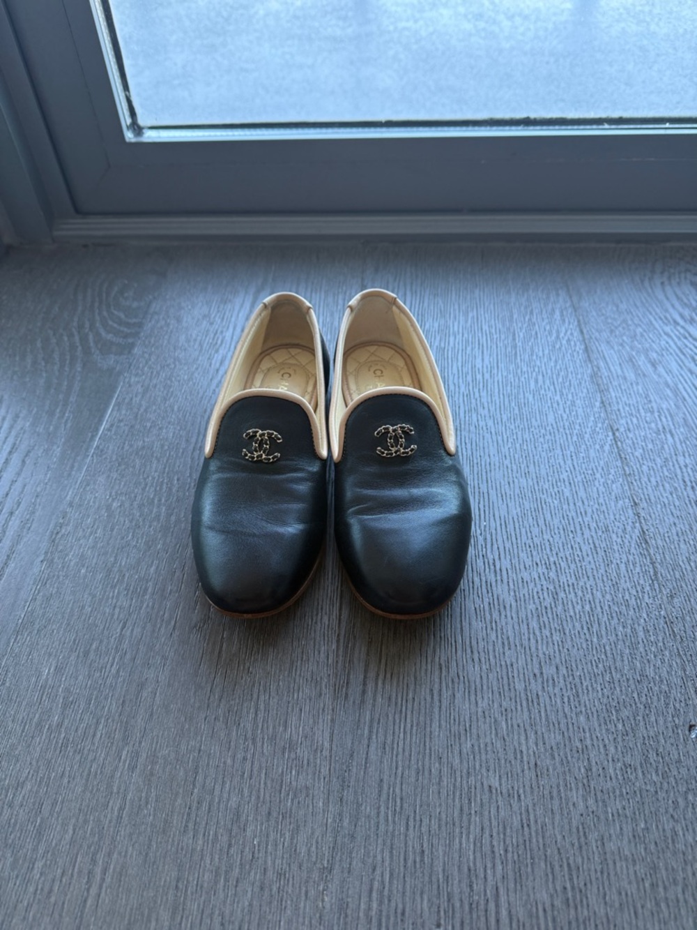CHANEL Black Leather Slip-On Loafers with Cream Trim and Gold CC
